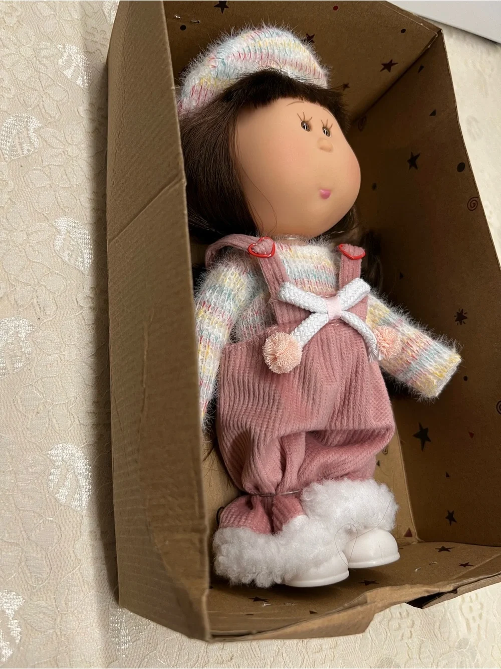 New, Mia Doll with Brown Hair Wearing a Pastel Sweater and Pink Overalls.